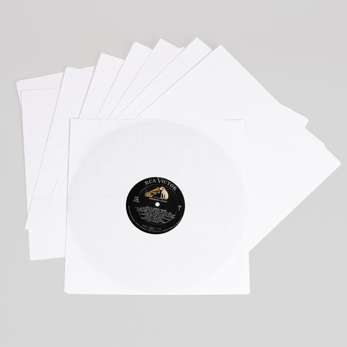 Fan of 12" record paper sleeves with a record inserted in the top sleeve.